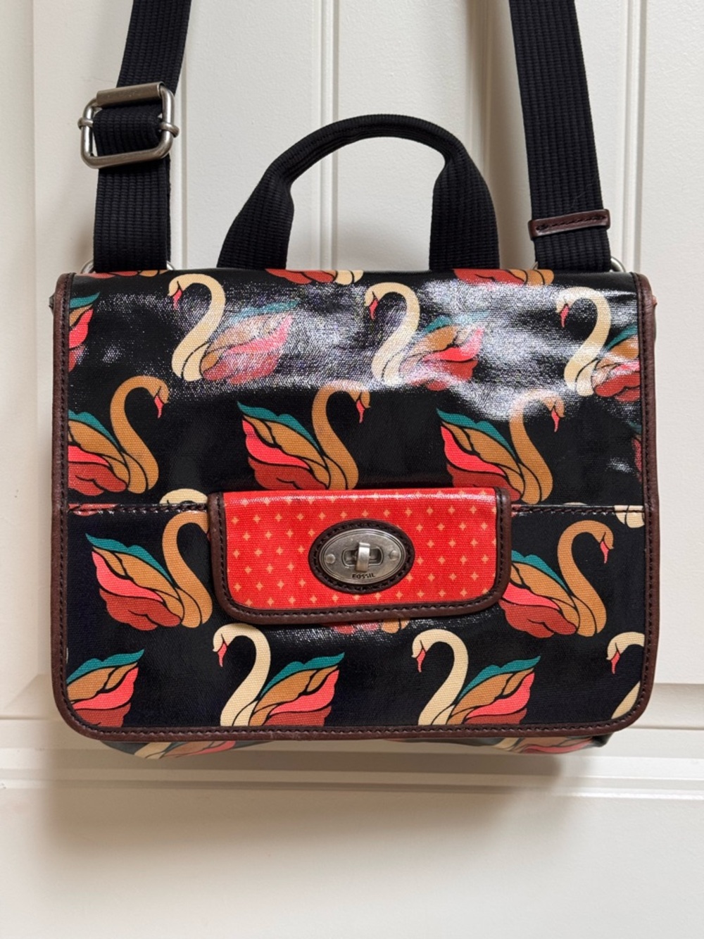 Fossil Key-Per Coated Canvas Swan Messenger Crossbody Bag. 12” by 10.5” by 1”